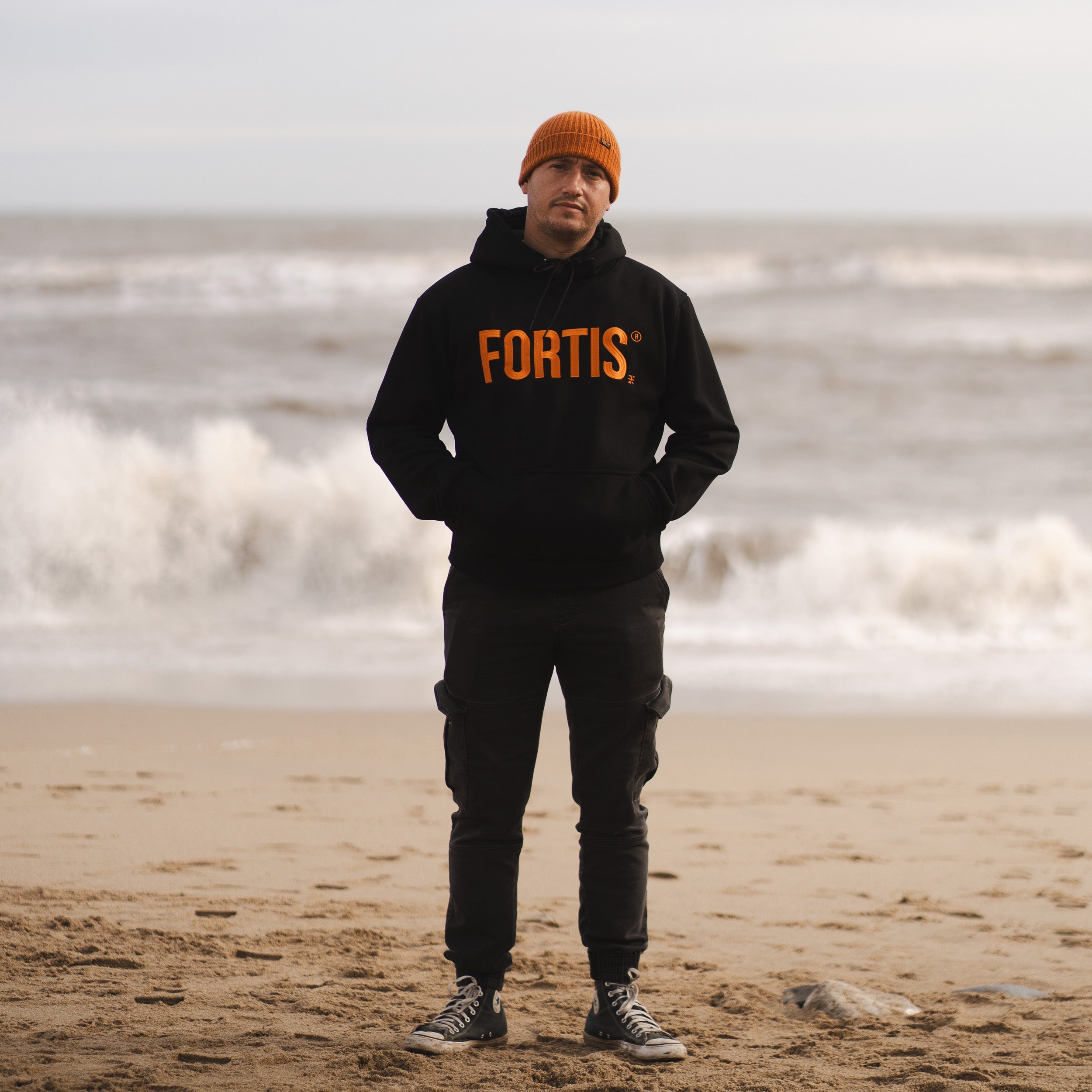 Fortis Black and Orange Hoodie In The Field