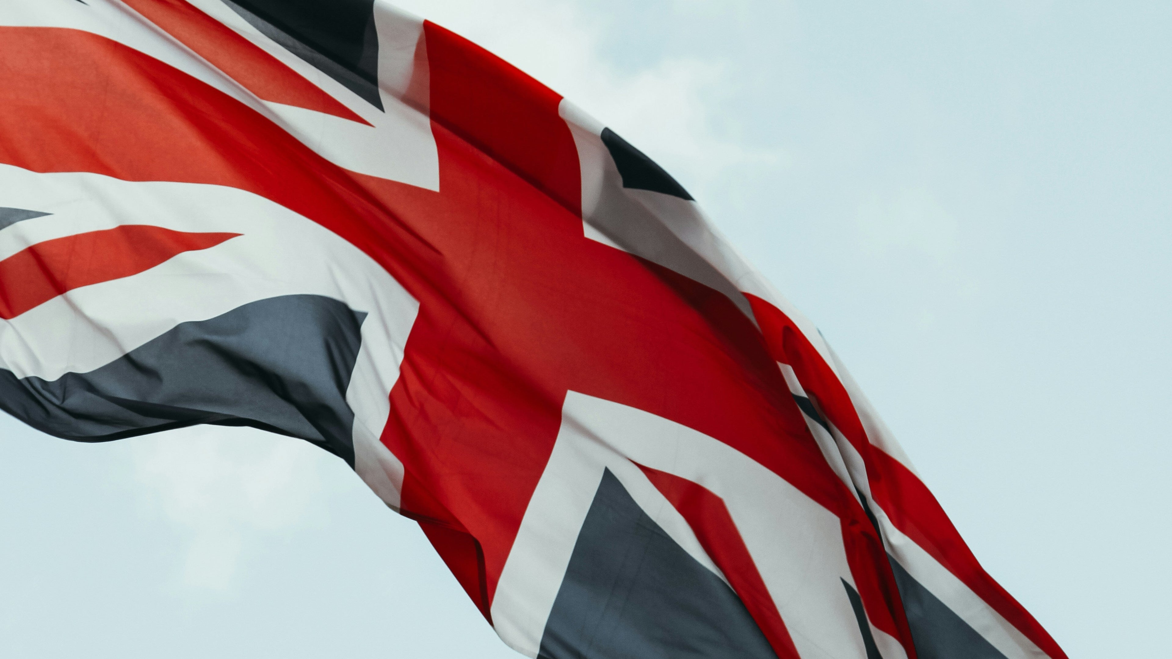 British flag waving against a clear blue sky